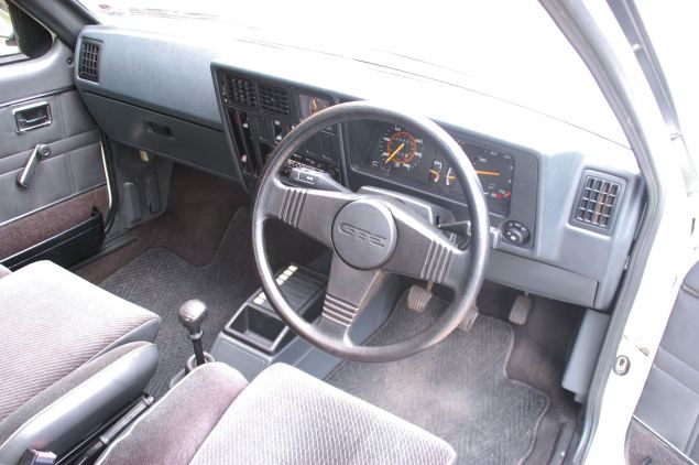 Plush and sporty interior on the original Astra GTE; note the cassette tape holders